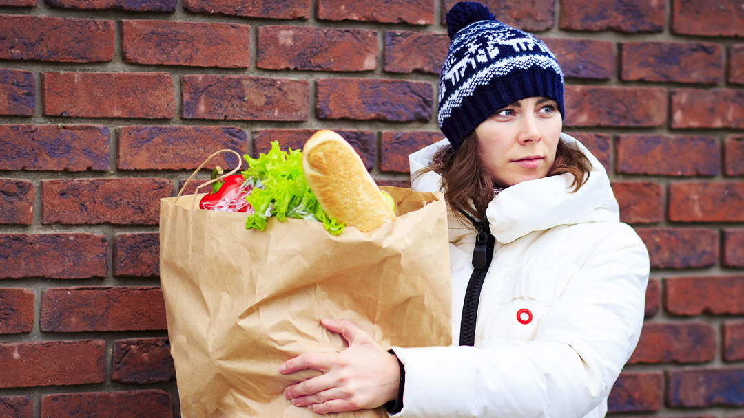 Women holding a bag of food