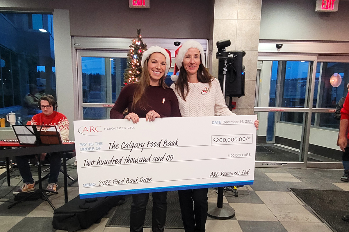 ARC Resources LTD staff holding a cheque to the Calgary Food Bank for $200,000